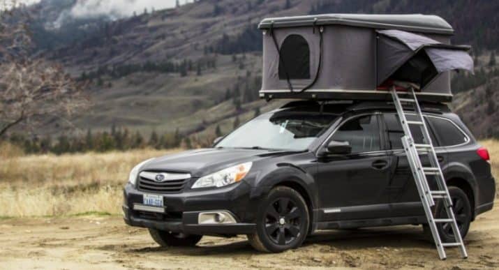 black car with a rooftop tent